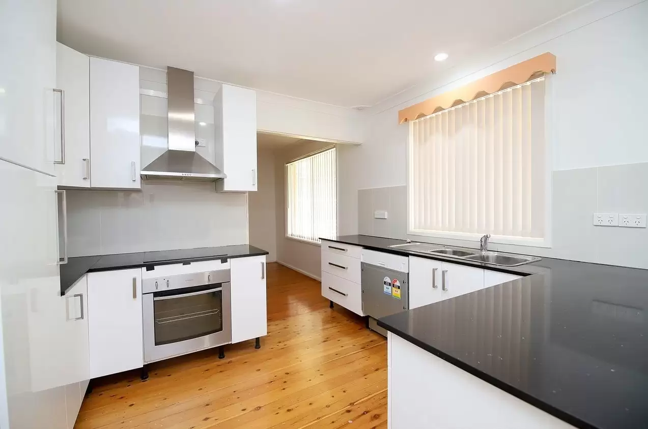 98 Rex Road, Georges Hall Sold by Richard Matthews Real Estate - image 1